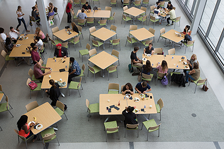 People gather in the atrium.