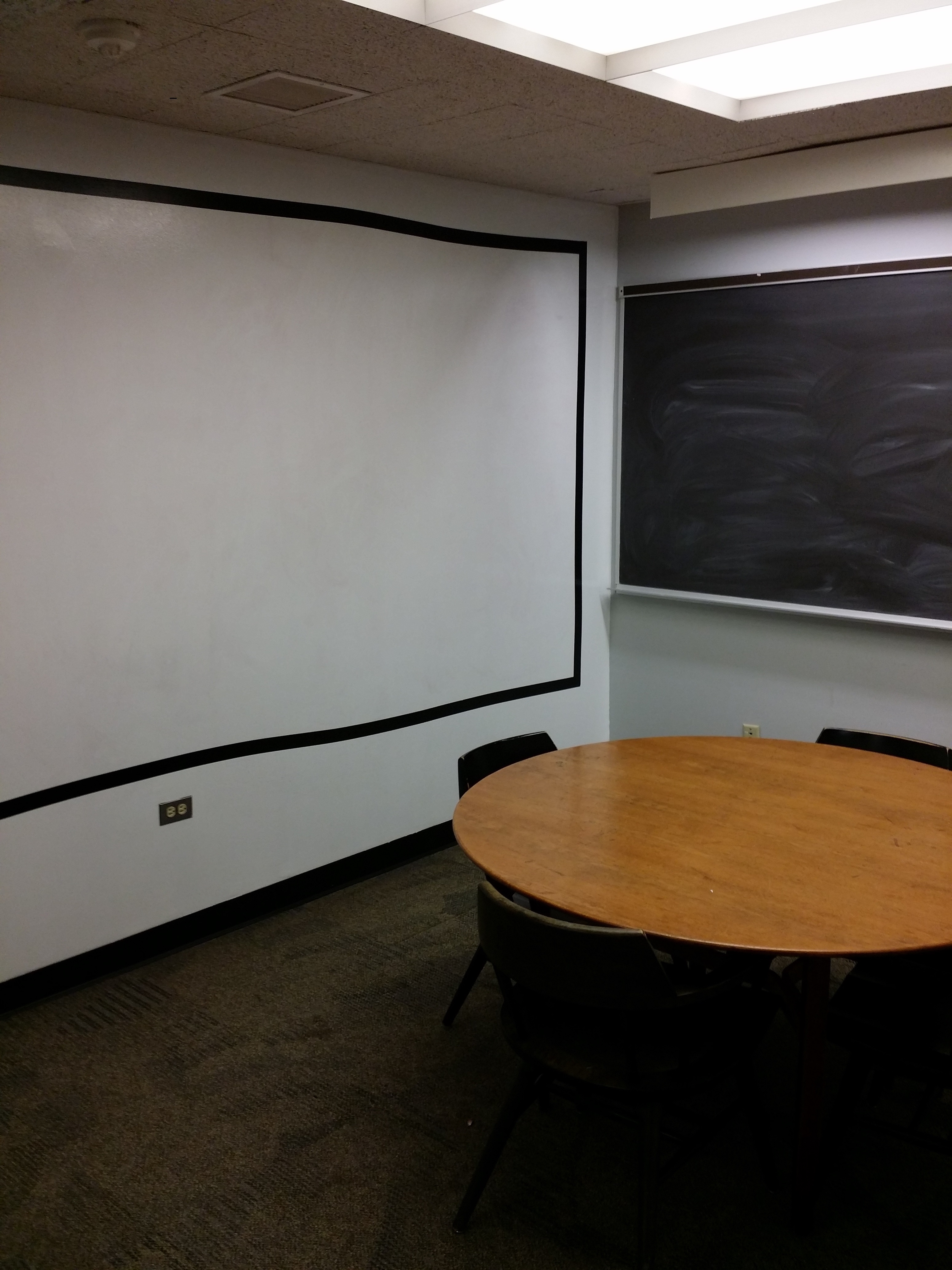 Room 1A includes a whiteboard wall.