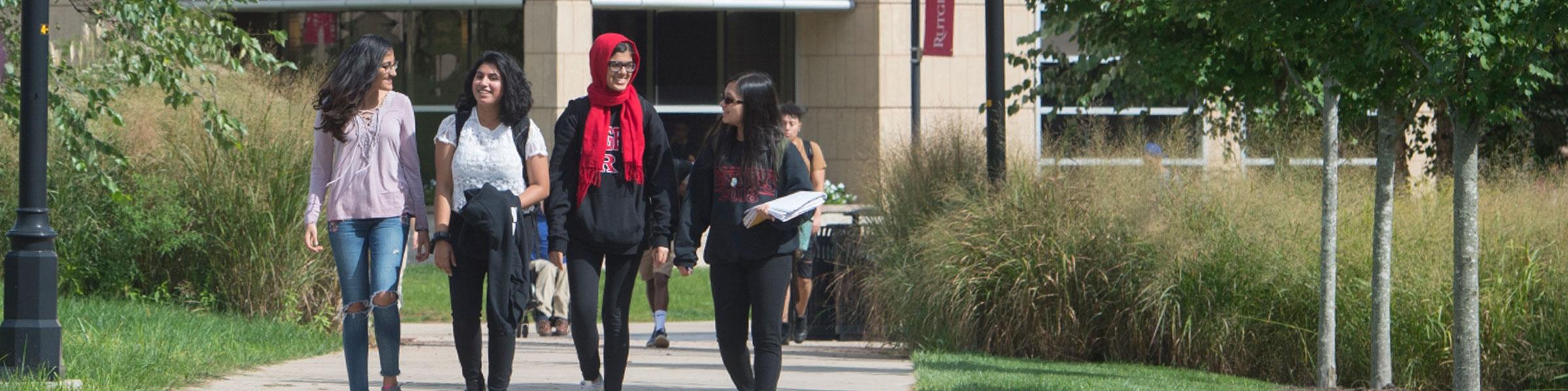 Four students stroll through Livingston campus.